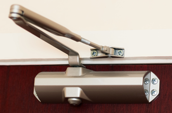 Newly installed door closers